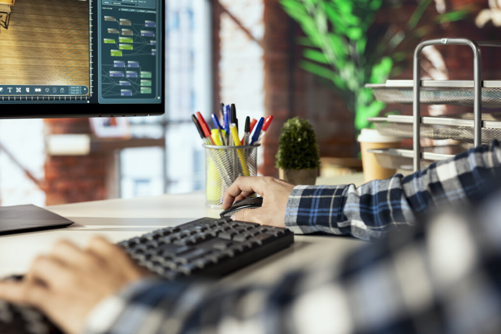 freelancer in home office using virtual home interior design software, close up